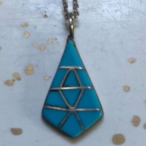 Zuni Pendant with silver necklace.